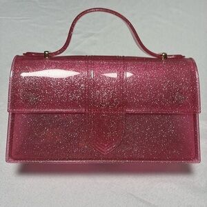 Jelly Purse, Pink Glitter comes w/strap. NWOT. Magnetic closure. Super Cute.